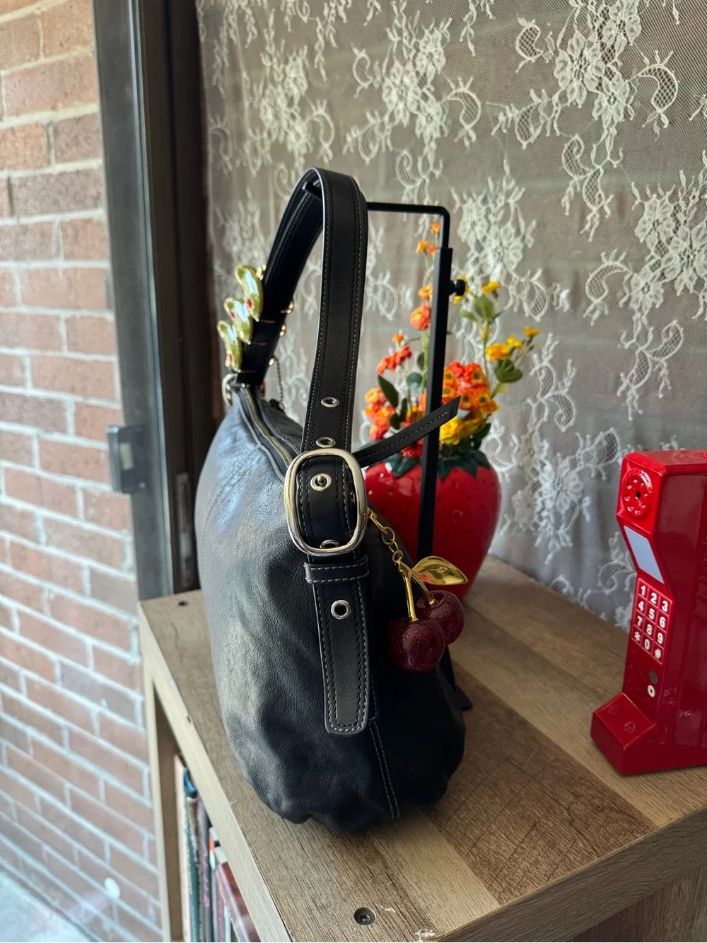 Coach Black Leather Shoulder Bag with Cherry Charm